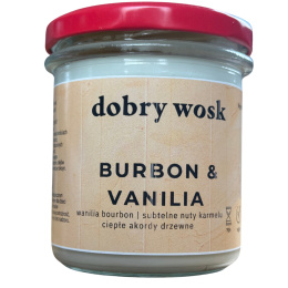 Naturalna świeca sojowa Dobry Wosk o zapachu Bourbon & Vanilla, w stylowym słoiku z czerwonym wieczkiem.
